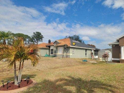 Dalton Roofing team completing a roof replacement in Jupiter, FL