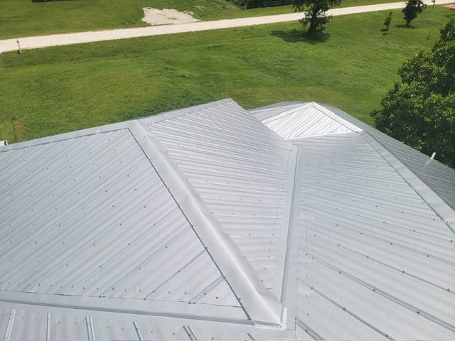 Aerial view of a completed standing-seam metal roof on a Loxahatchee, FL acreage property